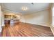 Large living room with hardwood floors, neutral walls, and open access to the kitchen at 876 Summerlake Dr, Fort Mill, SC 29715
