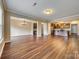 Open-concept living room with hardwood floors, a dining area, and a kitchen at 876 Summerlake Dr, Fort Mill, SC 29715