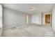 Bright main bedroom featuring plush carpeting, a neutral color palette, and closet at 876 Summerlake Dr, Fort Mill, SC 29715