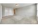 Inviting main bedroom with plush carpeting, neutral color scheme, closet, and natural light at 876 Summerlake Dr, Fort Mill, SC 29715