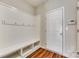 Organized mud room with built-in bench, coat hooks, and storage shelves at 876 Summerlake Dr, Fort Mill, SC 29715