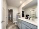 Bright bathroom with double sinks, large mirror and shower with decorative curtain at 9025 Remnick Dr, Gastonia, NC 28056