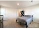 Bright bedroom with carpet, neutral walls, and closet for storage at 9025 Remnick Dr, Gastonia, NC 28056