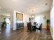 Bright dining room featuring wood floors, chandelier, and elegant decor at 9025 Remnick Dr, Gastonia, NC 28056