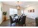 Bright dining room featuring wood floors, chandelier, and elegant decor at 9025 Remnick Dr, Gastonia, NC 28056