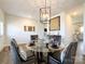 Bright dining room featuring wood floors, chandelier, and elegant decor at 9025 Remnick Dr, Gastonia, NC 28056