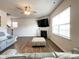 Comfortable living room features a fireplace, ceiling fan and lots of light at 9025 Remnick Dr, Gastonia, NC 28056