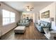 Open-concept living room flowing into the kitchen, featuring hardwood floors and natural light at 9025 Remnick Dr, Gastonia, NC 28056
