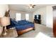 Spacious main bedroom featuring a king bed, carpet floors, and a television entertainment stand at 9025 Remnick Dr, Gastonia, NC 28056
