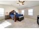 Spacious main bedroom with carpet, ceiling fan, and natural light from two windows at 9025 Remnick Dr, Gastonia, NC 28056