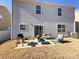 Backyard patio with outdoor seating and a grill perfect for gatherings at 9025 Remnick Dr, Gastonia, NC 28056