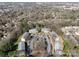Aerial view of the condos surrounded by trees and a parking lot at 9405 Old Concord Rd # G, Charlotte, NC 28213