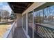 Exterior balcony featuring grey siding, a wooden deck and white railing, offering a relaxing outdoor space at 9405 Old Concord Rd # G, Charlotte, NC 28213