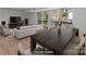 Staged dining and living room featuring wood-look floors and sliding glass doors to a balcony at 9405 Old Concord Rd # G, Charlotte, NC 28213