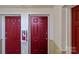 Hallway with red doors and a fire extinguisher at 9405 Old Concord Rd # G, Charlotte, NC 28213