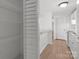 Bright kitchenette with a door to a storage space with wire shelving at 9405 Old Concord Rd # G, Charlotte, NC 28213