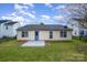 A cozy backyard featuring a small patio and ample green space, perfect for outdoor relaxation and entertaining at 10130 Illoria Dr, Charlotte, NC 28273