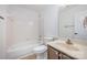 Bathroom featuring a tub-shower combo, a vanity and tile flooring at 10130 Illoria Dr, Charlotte, NC 28273