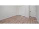 Bedroom showcasing hardwood flooring and a double-door closet for optimal storage at 10130 Illoria Dr, Charlotte, NC 28273