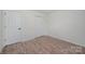 Bedroom featuring hardwood flooring, a double-door closet, and a light color palette at 10130 Illoria Dr, Charlotte, NC 28273