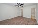 Bedroom showcasing a ceiling fan, ensuite bathroom, and walk-in closet at 10130 Illoria Dr, Charlotte, NC 28273