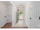 Light and airy entryway with tile flooring and access to coat closet, setting a welcoming tone at 10130 Illoria Dr, Charlotte, NC 28273
