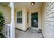 Inviting front porch featuring a storm door and windows, offering a warm welcome at 10130 Illoria Dr, Charlotte, NC 28273