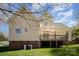 The home's back exterior shows a deck, brick foundation, and well-maintained lawn at 10502 Orchid Hill Ln, Charlotte, NC 28277