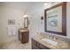 Well-lit bathroom featuring double sinks with granite countertops and tiled floors at 10502 Orchid Hill Ln, Charlotte, NC 28277