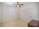 This simple bedroom features neutral paint, carpet, and a standard closet at 10502 Orchid Hill Ln, Charlotte, NC 28277