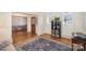 Welcoming foyer with hardwood floors, natural light, and views into the dining and living rooms at 10502 Orchid Hill Ln, Charlotte, NC 28277
