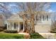 Charming two-story home featuring a welcoming front porch and a two car garage at 10502 Orchid Hill Ln, Charlotte, NC 28277