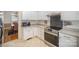 Kitchen featuring stainless steel appliances, granite countertops and white cabinetry at 10502 Orchid Hill Ln, Charlotte, NC 28277