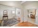 Inviting living room with hardwood floors, neutral colors, and a seamless flow into other spaces at 10502 Orchid Hill Ln, Charlotte, NC 28277
