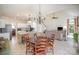 Open-concept living space featuring a dining area, kitchen, and staircase in a sunlit area at 10502 Orchid Hill Ln, Charlotte, NC 28277