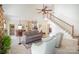 Spacious living room offering an open floor plan to the kitchen and dining area at 10502 Orchid Hill Ln, Charlotte, NC 28277