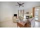 Cozy living room with fireplace, neutral colors, and ample natural light at 10502 Orchid Hill Ln, Charlotte, NC 28277