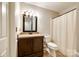 Functional bathroom featuring a vanity with granite-look countertop and a shower-tub combination at 10961 Carmel Crossing Rd, Charlotte, NC 28226