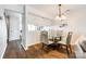 Bright dining area with glass-top table, modern chairs, and an inviting atmosphere next to kitchen at 10961 Carmel Crossing Rd, Charlotte, NC 28226