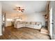 Spacious open-concept living room with wood-look floors, comfortable sectional, and lots of room to relax at 10961 Carmel Crossing Rd, Charlotte, NC 28226