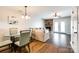 A comfortable seating area with a brick fireplace and lots of natural light flowing in through the nearby patio doors at 10961 Carmel Crossing Rd, Charlotte, NC 28226