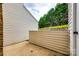 Enclosed patio area offers a private outdoor space next to a home with vinyl siding and lawn at 10961 Carmel Crossing Rd, Charlotte, NC 28226
