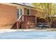 Brick home with a wooden deck, patio with seating, and a covered pool area, perfect for outdoor entertaining at 119 Tara Ter, Kings Mountain, NC 28086
