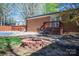 Private backyard boasts a brick patio, seating area, fire pit, and a covered pool at 119 Tara Ter, Kings Mountain, NC 28086