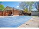 Home backyard with a large covered pool area, brick exterior, and wooden fence at 119 Tara Ter, Kings Mountain, NC 28086