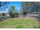 Large, grassy backyard with a storage shed and a tall, private fence for outdoor enjoyment at 119 Tara Ter, Kings Mountain, NC 28086