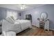 Bright bedroom features a comfortable bed, dresser, and vanity with warm wood flooring at 119 Tara Ter, Kings Mountain, NC 28086