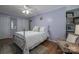Comfortable bedroom with hardwood floors and cozy seating area filled with natural light at 119 Tara Ter, Kings Mountain, NC 28086