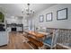 Dining area featuring a wooden table with bench seating and patterned wallpaper at 119 Tara Ter, Kings Mountain, NC 28086