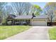 Inviting single-story brick home with a spacious driveway and meticulously landscaped yard at 119 Tara Ter, Kings Mountain, NC 28086